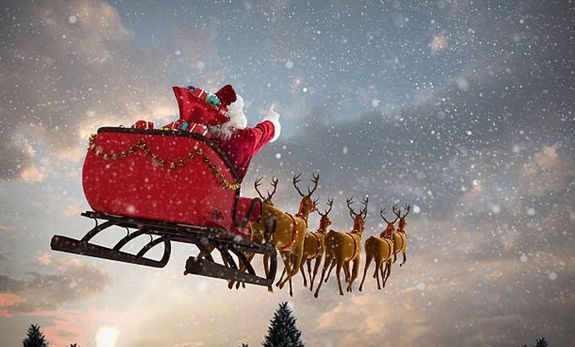 s nem res kzzel rkezik, hanem ajndkokkal megrakott sznnal, amelyet rnszarvasok reptenek. Kp: iStock